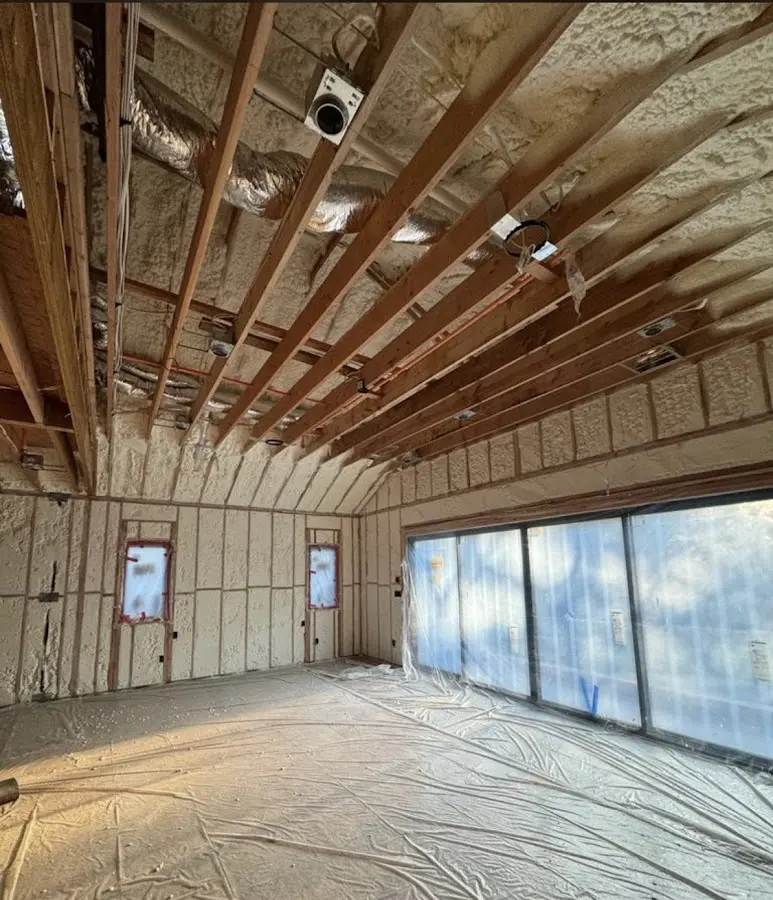 Interior walls and ceiling insulated with spray foam during new construction in Rindge